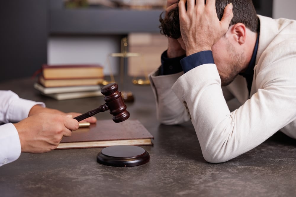 man-meeting-with-lawyer-worried